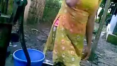 Sexy village girl having an open bath