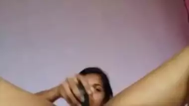 Desi girl stripping and masturbating with a big black dildo