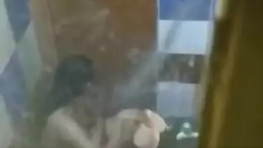 Perv is going to jerk off to porn video of Desi neighbor taking a shower