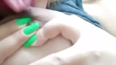 Busty desi XXX bitch showing and licking her big melons on cam