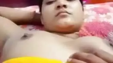 Desi fatty poses in XXX clip with young man who plays with her tits