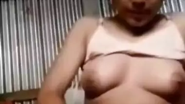 Beautiful Desi XXX girl fingering her teen pussy in the garage