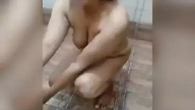 Busty girl friend shy in toilet