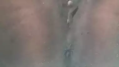 Tattooed Indian slut plays with her boobs and dark cunt underneath the water while in the bathtub