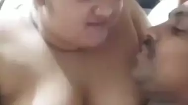 Chubby wife soft boobs pressed against husband in foreplay