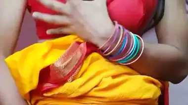 Indian shemale enjoys strip teasing and masturbating