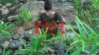 Young girl bathing in jungle showing hot bareback and cleavage