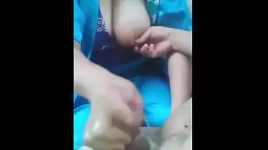 Milf with big boobs gives her colleague a nice handjob