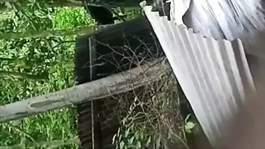 Village neighbor girl outdoor bath caught through hole