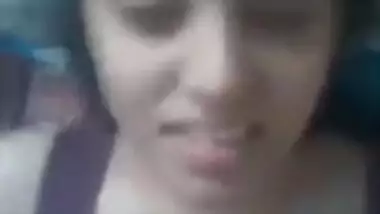 Cute girlfriend sensually licks the dick head