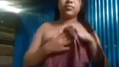 Cute slum girl recording her own dress change